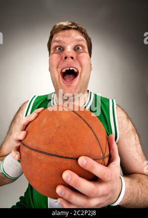 Portrait of bizarre basketball player with ball Stock Photo