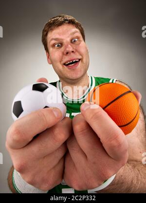 Portrait of surprised basketball player with two balls Stock Photo