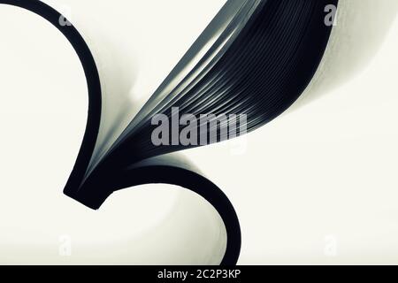 Paper sheets forming abstract curves. Toned image Stock Photo