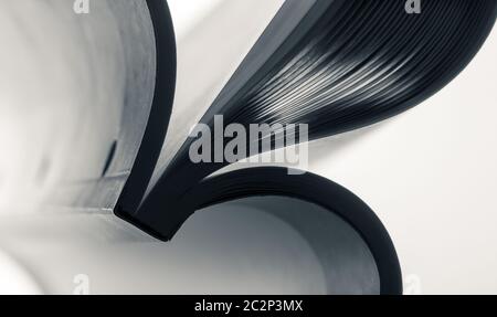 Macro view of abstract paper curves. Toned in blue color Stock Photo