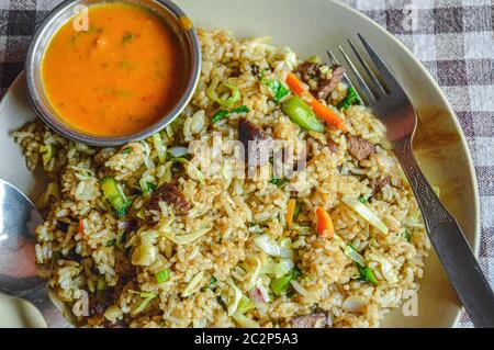 Khukara ko pulao or traditional nepali chicken fried rice Stock Photo