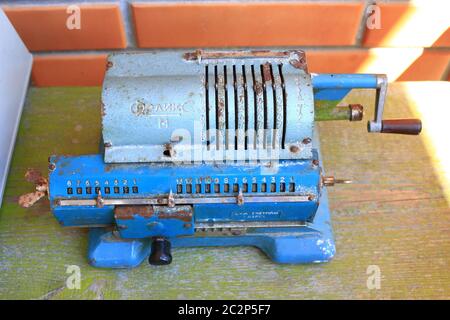 Vintage antique arithmometer named Felix. Old retro blue calculator. Old mechanical calculator as me Stock Photo