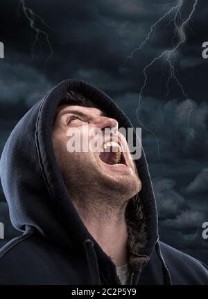 Despair bandit screaming to dark sky Stock Photo
