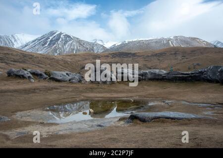 Rock formations and reflections at Kura Tawhiti Castle Hill Conservation Area, Canterbury, New Zealand Stock Photo