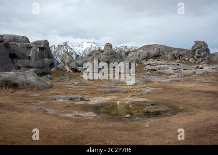 Rock formations and reflections at Kura Tawhiti Castle Hill Conservation Area, Canterbury, New Zealand Stock Photo