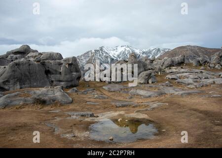 Rock formations and reflections at Kura Tawhiti Castle Hill Conservation Area, Canterbury, New Zealand Stock Photo