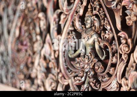 Elaborate traditional thai wall design of an Apsara Dancer in Wat Arun temple in Bangkok, Thailand Stock Photo