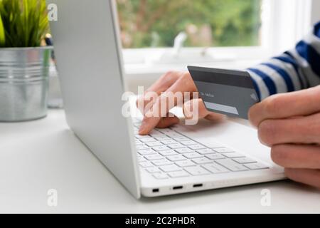 Using credit card for online shopping Stock Photo