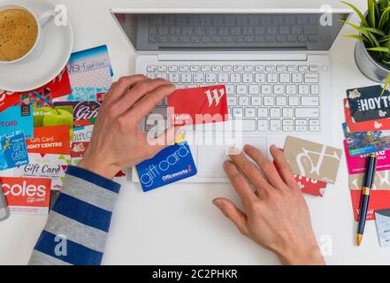 Top down view of online shopping using gift cards Stock Photo