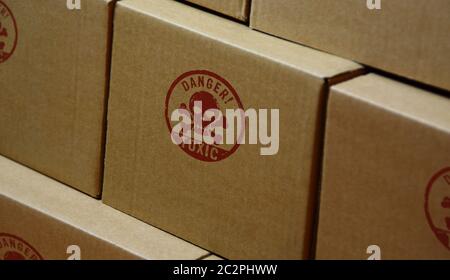 Toxic danger with skull stamp printed on cardboard box. Poison warning concept. Stock Photo