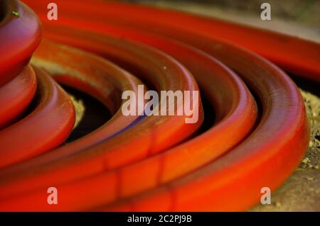 A roll of orange cables. Construction of optical fiber installation. Stock Photo