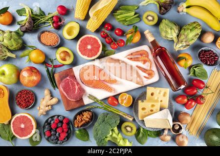Food, overhead photo of many different products, with meat, fish, chicken and shrimps, vegetables and fruits, legumes, wine, pas Stock Photo