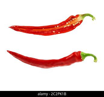 half red hot pepper with seeds and the whole fruit isolated on a white background, close up Stock Photo