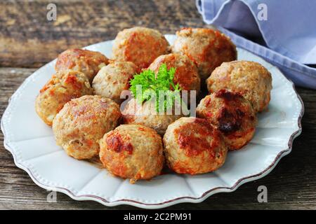 Fried meat ball, delicious meat cutlets on rustic dark table . Stock Photo