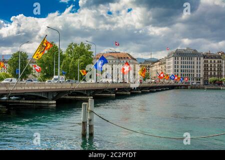 Flags fluttering over Mont Blanc Bridge in Geneva, Switzerland Stock Photo