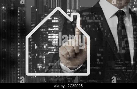 House Icon Concept is shown by businessman. Stock Photo