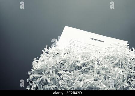 Big heap of white shredded papers with agreement Stock Photo