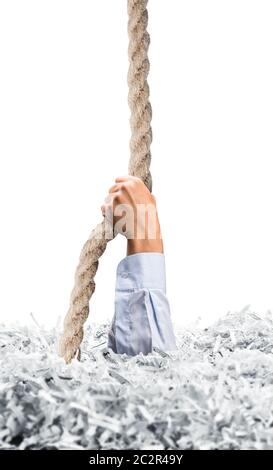 Stretches hand from big heap of white shredded papers and catching the rope Stock Photo