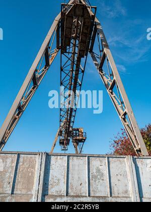 Industrial crane for carrying goods at the factory. Industrial landscape. Place for text. Stock Photo