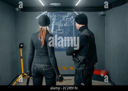 Bank robbery of the century, two robbers working on a plan to rob the vault. Criminal profession, theft concept Stock Photo