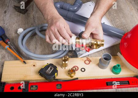 a close up of plumbing with different tools and accessories Stock Photo
