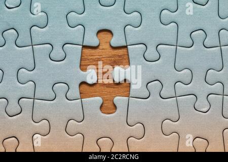 Jigsaw puzzle background, one last piece missing only, almost complete Stock Photo