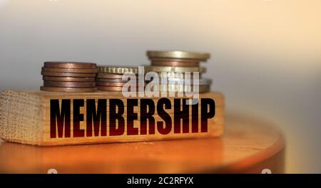 Memebership word on building blocks and stacks of coins. VIP business special services concept Stock Photo