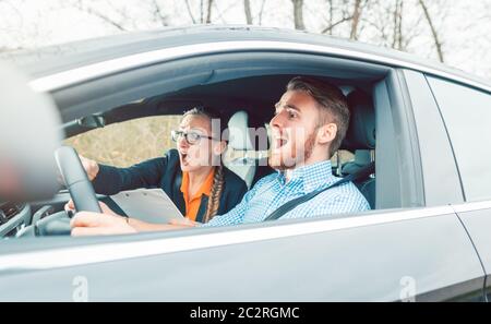 Dangerous situation in the school car during driving instruction or test Stock Photo
