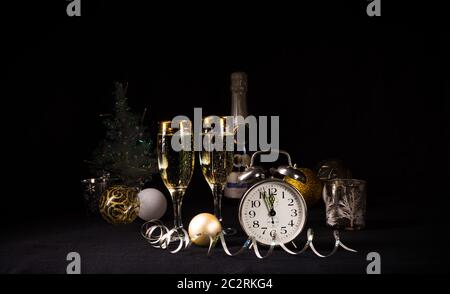 New Year's motives - clock, glasses and confetti Stock Photo