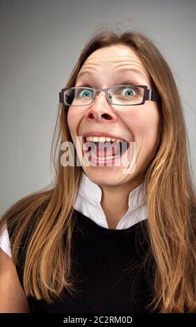 Portrait of stressed insane laughing business woman Stock Photo