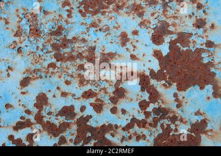 A Rusty And Worn Old Sheet of Metal Painted Pale Blue Stock Photo