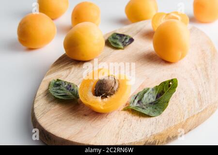 Close-up of ripe peaches on the table. Ripe peaches with leaves Stock Photo