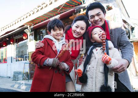 The family ate sugar-coated berry happy travel Stock Photo