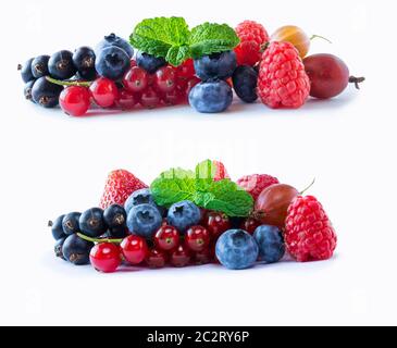 Set of fresh fruits and berries. Ripe blueberries, red currants, black currant, raspberries and strawberries. Mix berries isolated on a white. Various Stock Photo