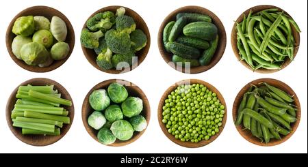Green vegetables isolated on a white. Set of green vegetablees on a white background. Top view. Broccoli, green peas, cucumbers, zucchini, brussels sp Stock Photo