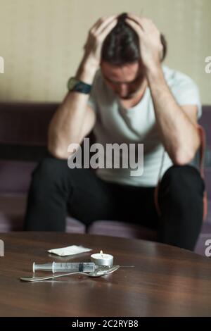 Abuse of drugs leads to a depression.  Drug use, crime, addiction, dependence and people concept Stock Photo