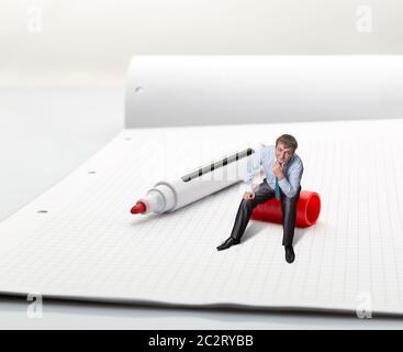 A man sitting on high-lighter thinks Stock Photo
