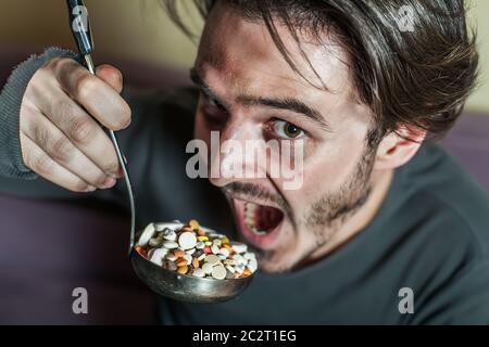Abuse of drugs leads to overdosing. Drug addict suicide concept. Stock Photo