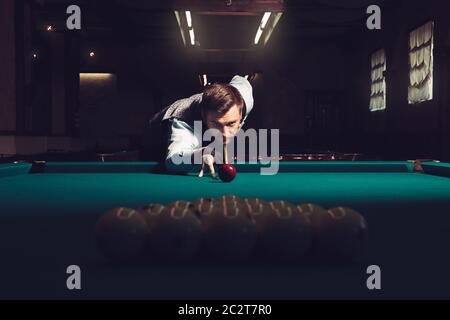 Young man preparing to shoot balls in triangle Stock Photo