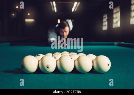 Young man preparing to shoot balls in triangle Stock Photo