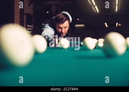 Young man preparing to shoot balls in triangle Stock Photo
