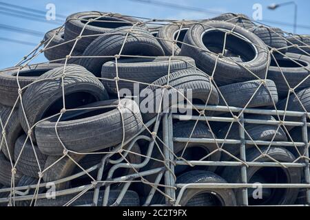 Used car tires being transported in a pickup truck. Stock Photo