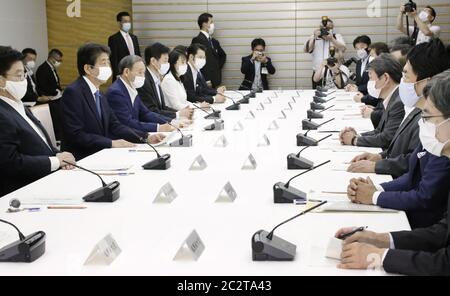 Tokyo, Japan. 18th June 2020. Japanese Prime Minister Shinzo Abe (2nd from L) attends a meeting of the government's anti-coronavirus task force at his office in Tokyo on June 18, 2020. (Kyodo)==Kyodo Photo via Credit: Newscom/Alamy Live News