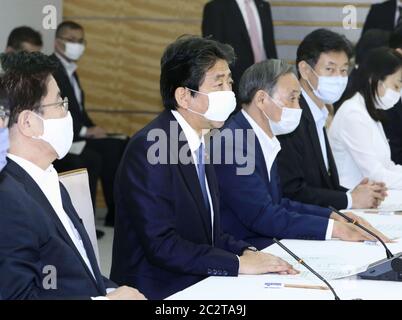 Tokyo, Japan. 18th June 2020. Japanese Prime Minister Shinzo Abe (2nd from L) speaks during a meeting of the government's anti-coronavirus task force at his office in Tokyo on June 18, 2020. (Kyodo)==Kyodo Photo via Credit: Newscom/Alamy Live News