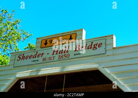 Phoenixville, PA, USA - June 14, 2020: The Sheeder-Hall  Bridge is a 100-foot-long covered bridge in Chester County. It crosses French Creek and was c Stock Photo