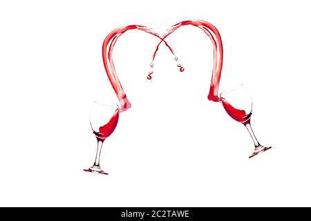 Red wine glass splash, two glasses of red wine splashing in an arc shape against a white background cut out Stock Photo