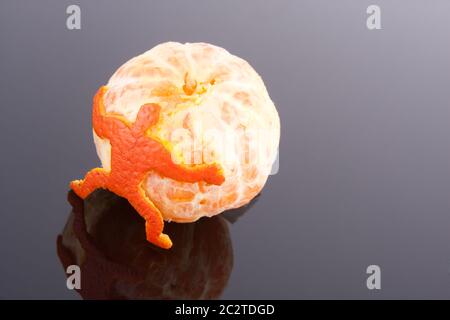 A strong man of peel holding big mandarin Stock Photo