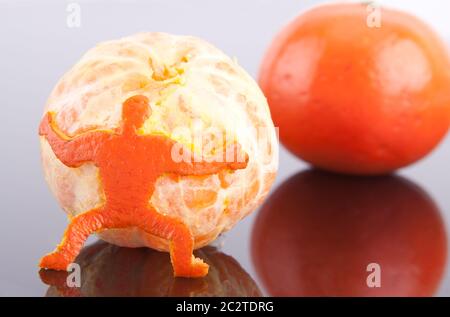 A strong man of peel holding big mandarin Stock Photo