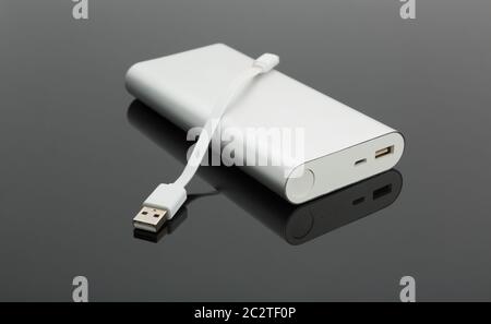 Power bank and a short cable on the table Stock Photo