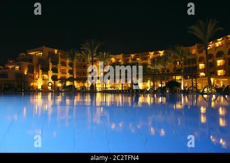 Five star hotel building with swimming pool in evening. luxurious hotel Stock Photo